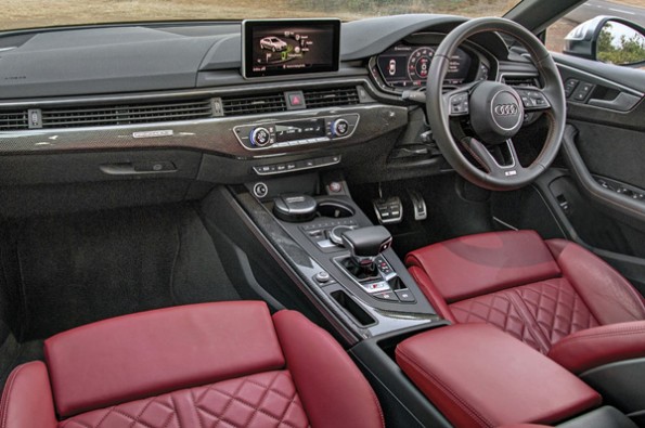 Red leather seats in the Audi are of high-quality.