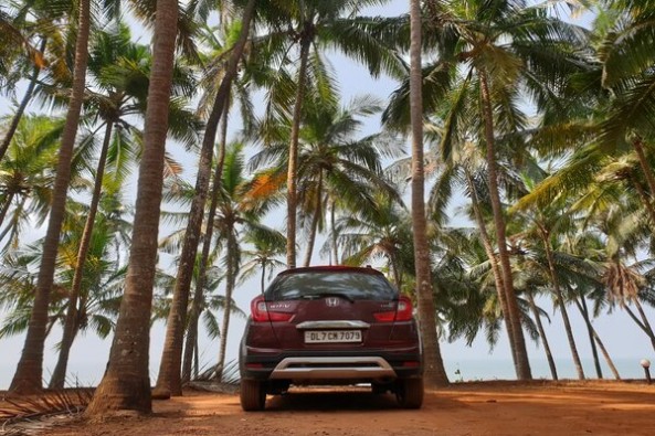 Red Color Honda WR-V Rear Profile Among Trees