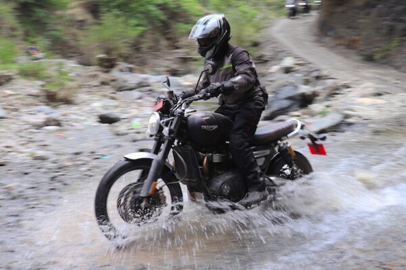 Triumph Scrambler Wading Through Water Side Profile