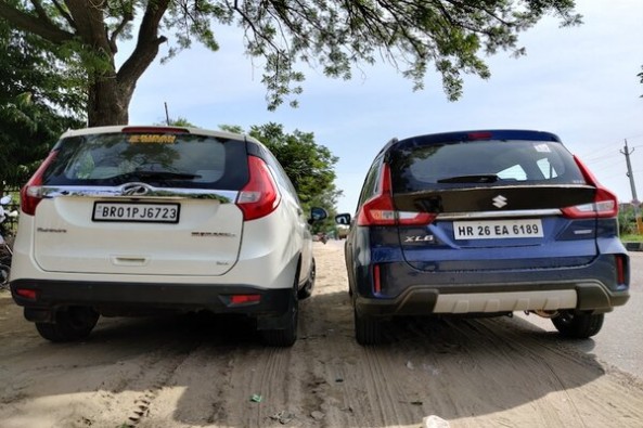 Blue Color Maruti Suzuki XL6 and White Color Mahindra Marazzo Rear Profiles