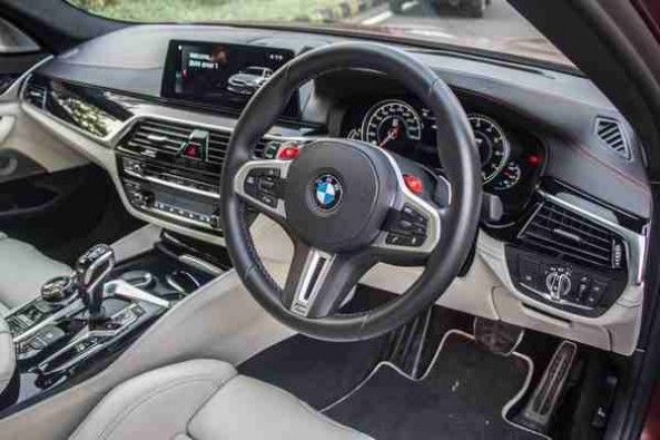 The BMW M5 gets two customizable driving modes on the steering wheel