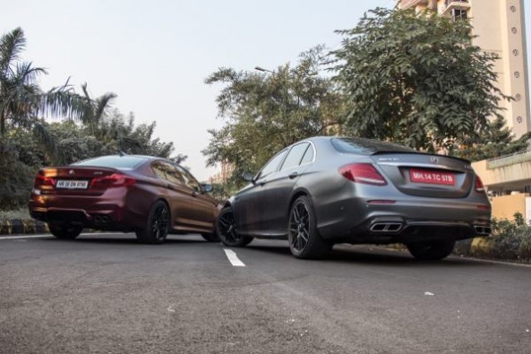 The E63s has chrome touches while the M5 gets a black treatment