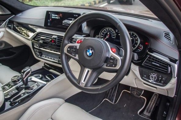 The BMW M5 gets two customizable M buttons on the steering wheel