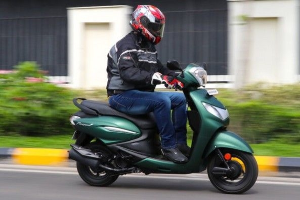 Green Color Hero Pleasure Plus Side Profile With Rider