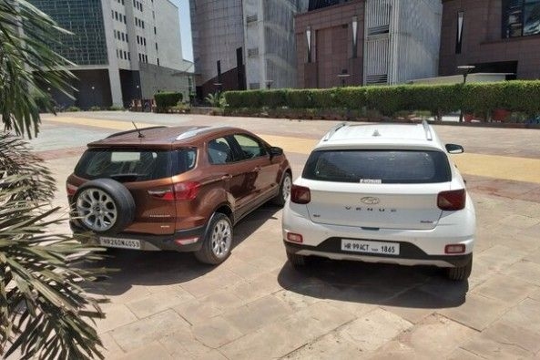 White Color Hyundai Venue and Copper Color Ford EcoSport Rear Profiles